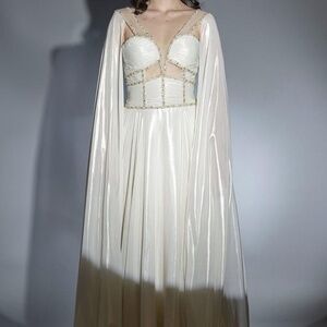 Light beige/ yellow dress with attached cape and details